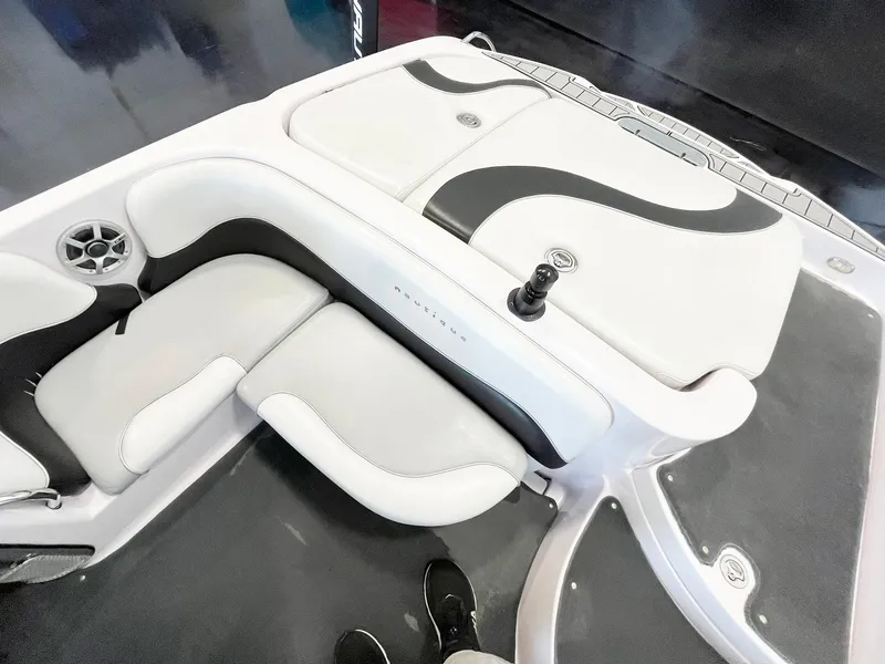 Slide: The Image of 2005 Nautique Air Nautique SV-211 boat interior with white and black seating. - 9