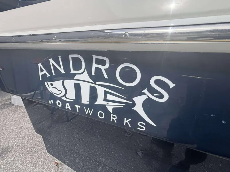 Slide: The Image of Andros Tarpon 26 boat logo on dark hull, 2015 model. - 4