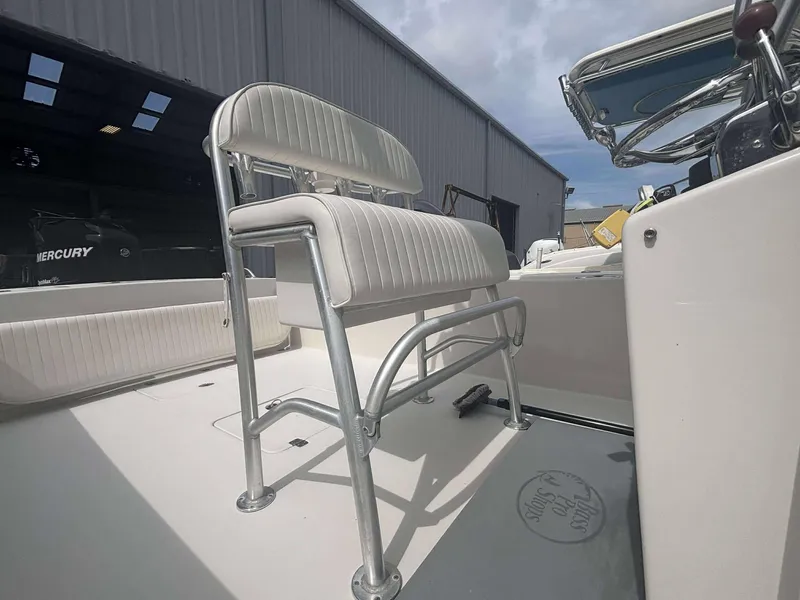 Slide: The Image of 2015 Andros Tarpon 26 boat interior with seating and steering console. - 9