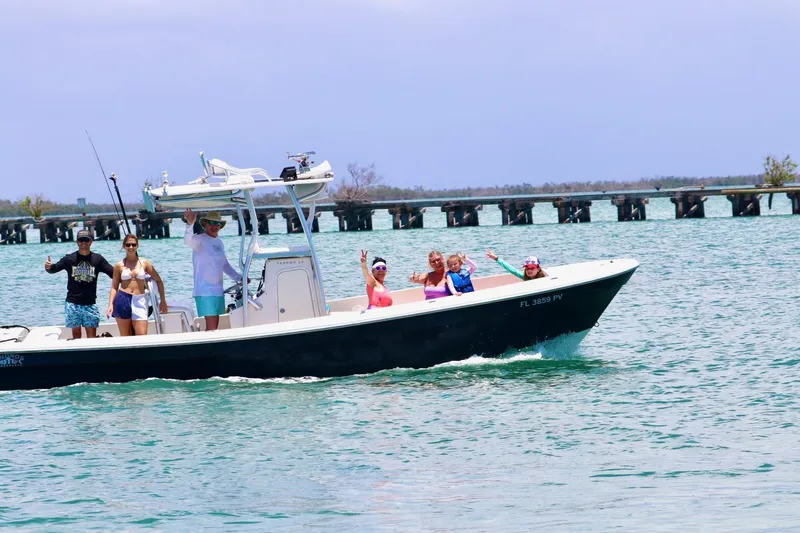 The Image of People enjoying a ride on a 2015 Andros Tarpon 26 boat in sunny waters. - 0
