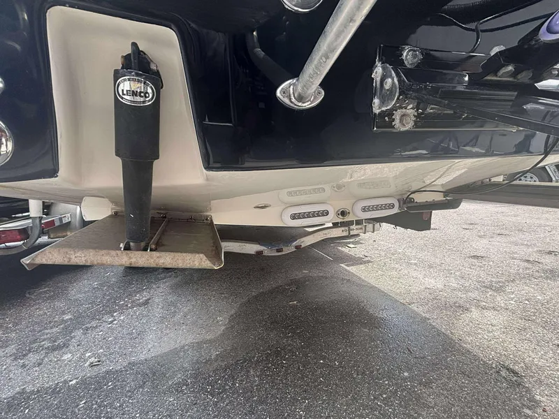 Slide: The Image of 2015 Andros Tarpon 26 boat underside with Lenco trim tab and LED lights. - 17