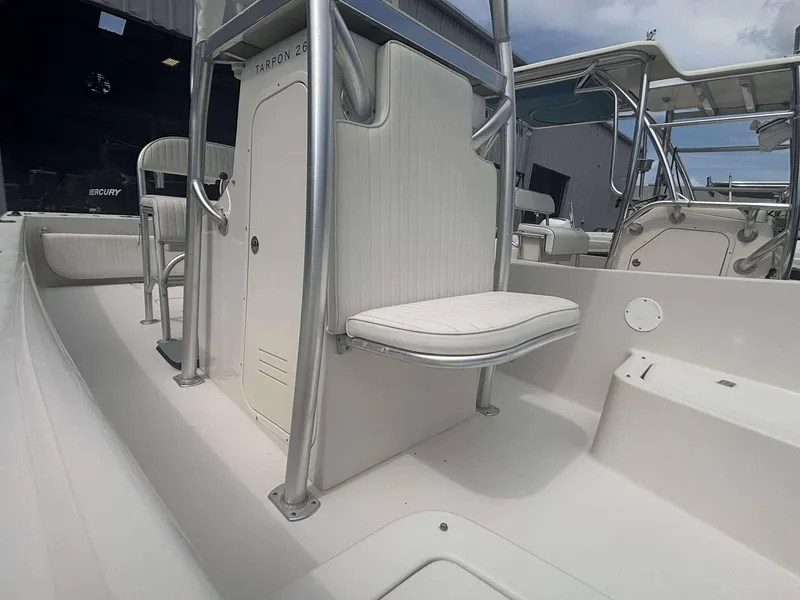 Slide: The Image of 2015 Andros Tarpon 26 boat interior with seating and console, showcasing sleek design and functionality. - 7