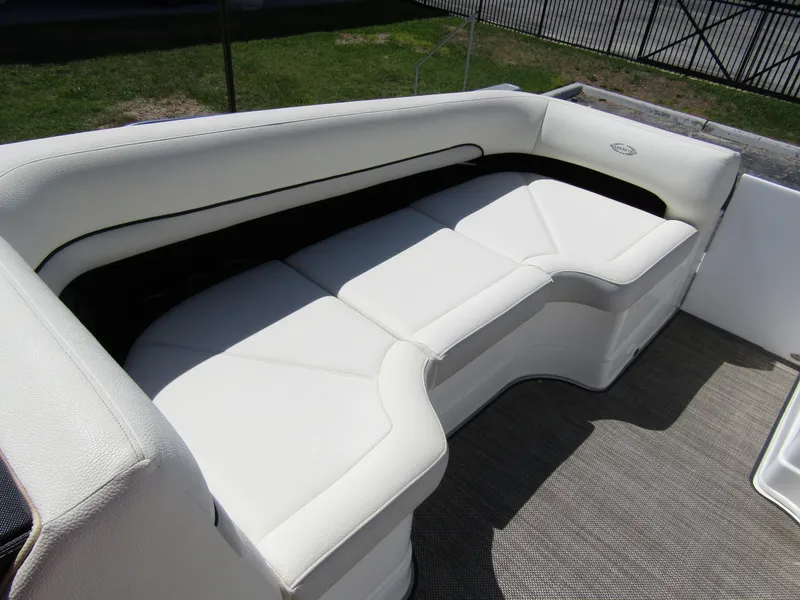 Slide: The Image of Luxurious seating on 2017 Cobalt Marker One Ml4 boat, featuring white upholstery. - 14