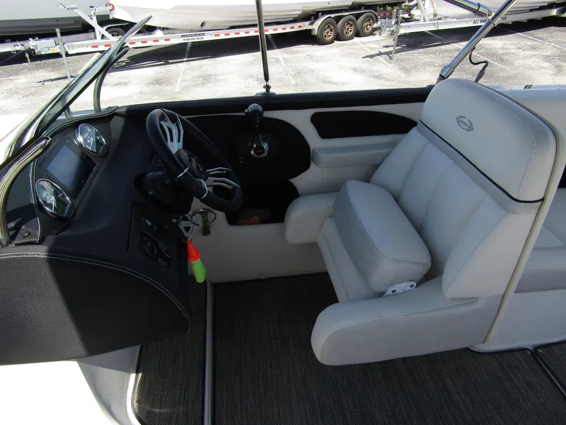 Slide: The Image of 2017 Cobalt Marker One Ml4 boat interior with steering wheel and cushioned seat. - 19