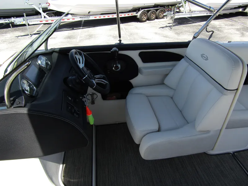 Slide: The Image of 2017 Cobalt Marker One Ml4 boat interior with steering wheel and plush seating. - 20