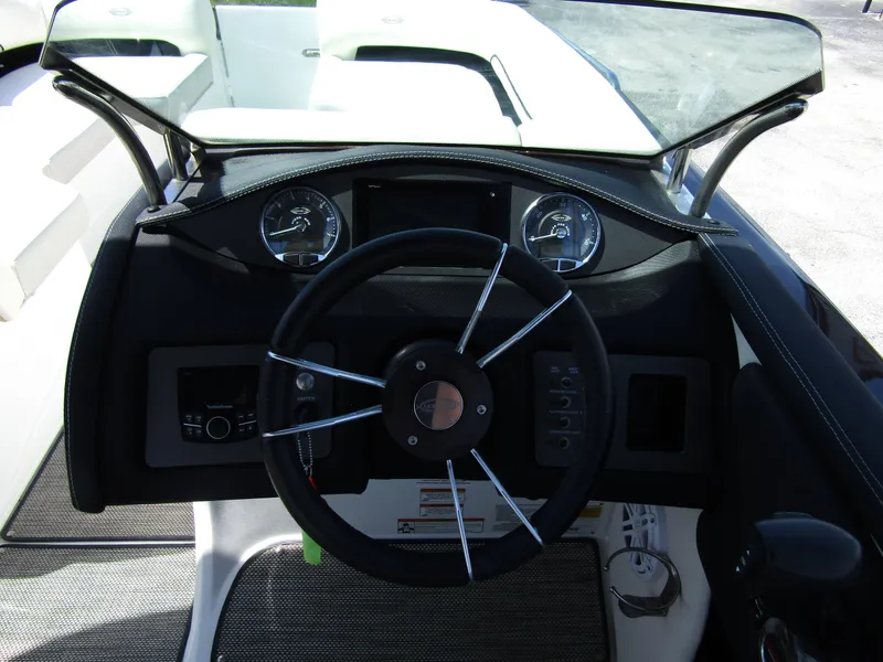 Slide: The Image of 2017 Cobalt Marker One Ml4 boat dashboard with steering wheel and gauges. - 21