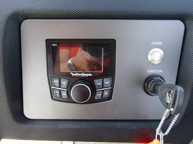 Slide: The Image of Control panel of 2017 Cobalt Marker One Ml4 with Rockford Fosgate audio system and ignition key. - 22