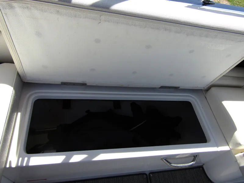 Slide: The Image of Open storage compartment in a 2017 Cobalt Marker One Ml4 boat. - 28