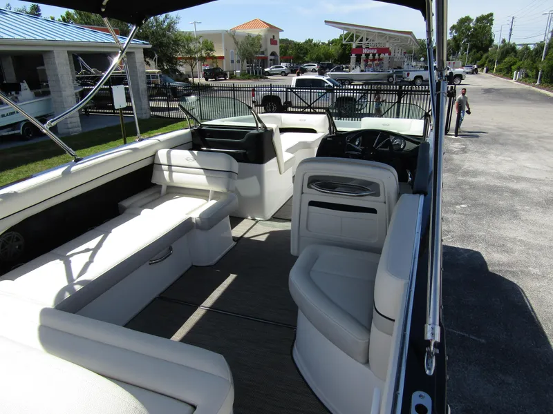 Slide: The Image of 2017 Cobalt Marker One Ml4 boat interior with white seating and steering area. - 34