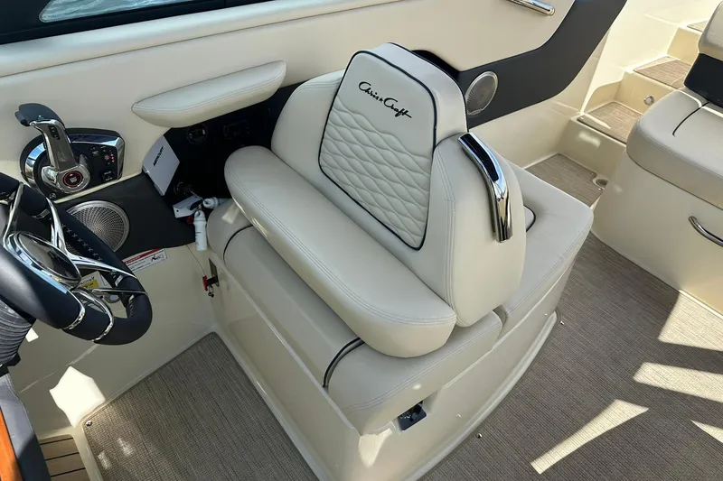 Slide: The Image of 2026 Chris-Craft Sportster 25 interior with luxurious seating and modern controls. - 19