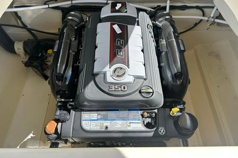 Slide: The Image of Engine compartment of 2026 Chris-Craft Sportster 25 with a 350 horsepower engine. - 22