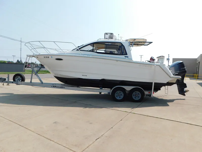 The Image of 2017 Cutwater C-24 boat on trailer, parked outdoors, side view. - 0
