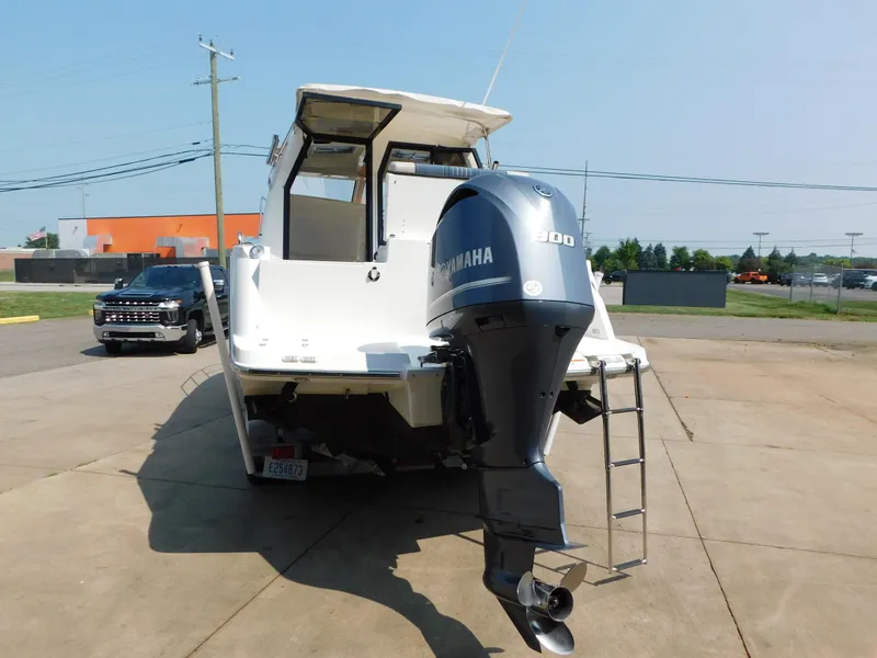 Slide: The Image of 2017 Cutwater C-24 boat with Yamaha 300 outboard motor, parked on concrete. - 10