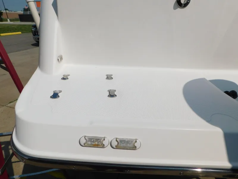 Slide: The Image of 2017 Cutwater C-24 boat deck with cleats and lights, viewed from the rear. - 16