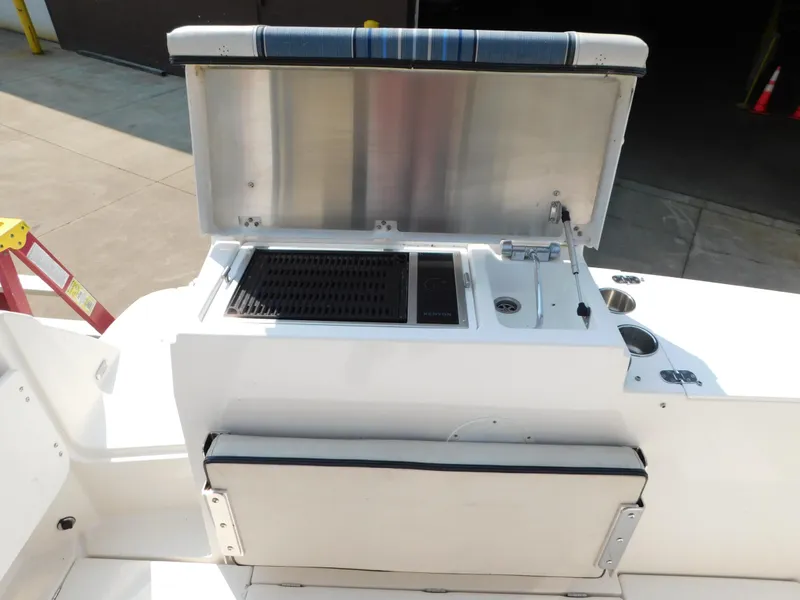 Slide: The Image of 2017 Cutwater C-24 boat with open grill and sink on deck. - 21