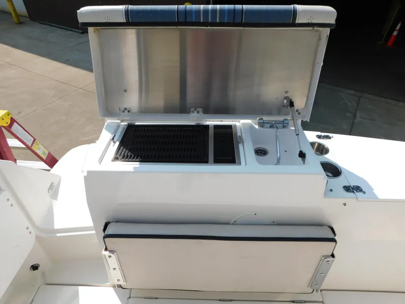 Slide: The Image of 2017 Cutwater C-24 boat with open grill and sink on deck. - 22