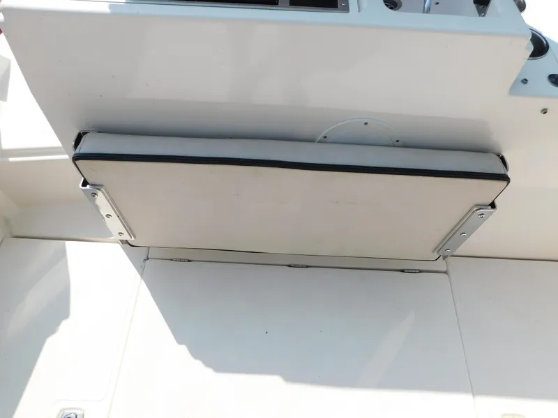 Slide: The Image of 2017 Cutwater C-24 boat seat folded against white interior panel. - 23