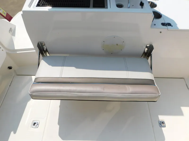 Slide: The Image of 2017 Cutwater C-24 boat seat with foldable design and integrated storage. - 24