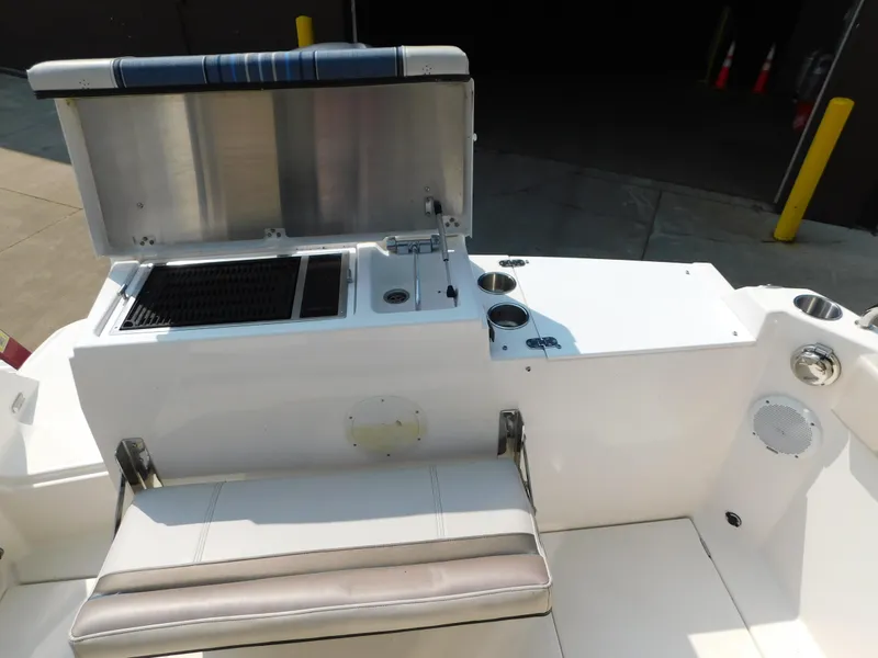 Slide: The Image of 2017 Cutwater C-24 boat interior with seating, grill, and storage compartments. - 25