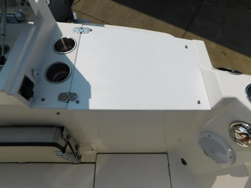 Slide: The Image of 2017 Cutwater C-24 boat interior with cup holders and storage compartment. - 26