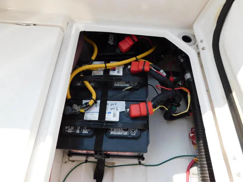 Slide: The Image of Battery compartment of a 2017 Cutwater C-24 boat with wiring and connections. - 34