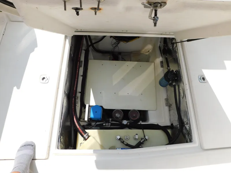 Slide: The Image of Engine compartment of a 2017 Cutwater C-24 boat, showing mechanical components and wiring. - 37