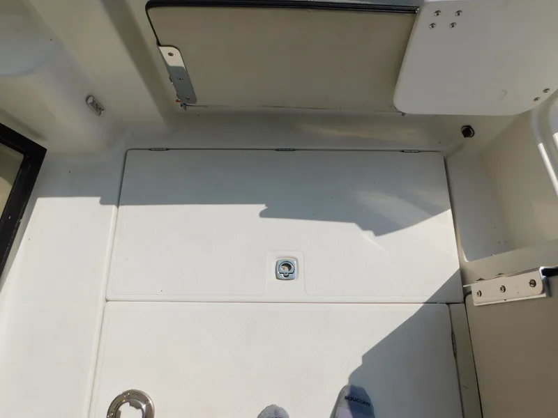 Slide: The Image of 2017 Cutwater C-24 boat deck with storage hatch and clean white surface. - 38