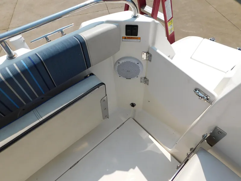 Slide: The Image of Interior of 2017 Cutwater C-24 boat with striped seating and speaker. - 42