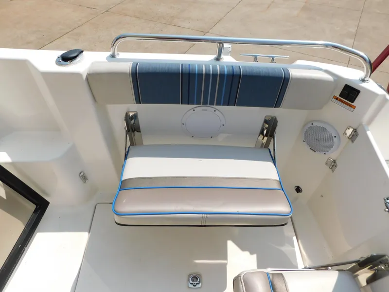 Slide: The Image of 2017 Cutwater C-24 boat interior with cushioned seating and stainless steel railing. - 44