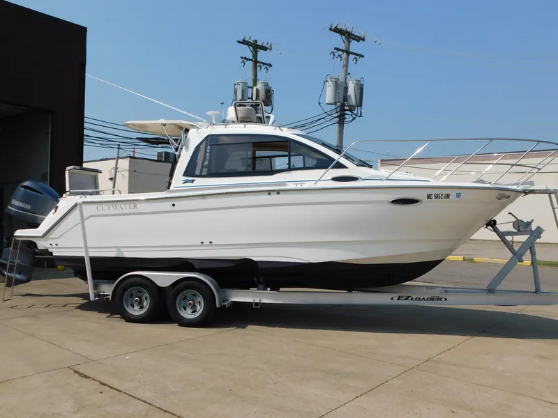 Slide: The Image of 2017 Cutwater C-24 boat on trailer, side view, parked outdoors. - 5