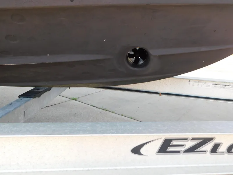 Slide: The Image of 2017 Cutwater C-24 boat hull on EZ Loader trailer, showing propeller detail. - 6