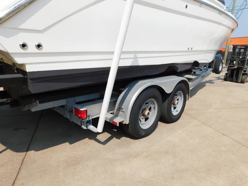 Slide: The Image of 2017 Cutwater C-24 boat on a dual-axle trailer, parked on concrete. - 9