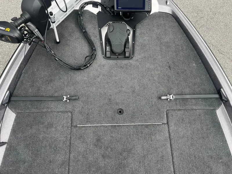 Slide: The Image of 2024 Skeeter ZXR 20 boat deck with trolling motor and control panel. - 18