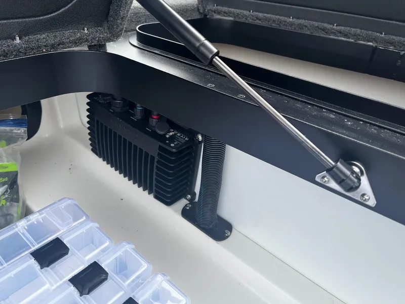 Slide: The Image of 2024 Skeeter ZXR 20 boat compartment with storage and electronic components. - 21