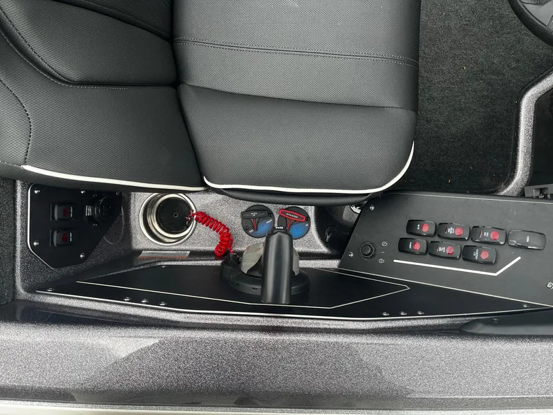 Slide: The Image of 2024 Skeeter ZXR 20 boat interior with control panel and seating. - 25