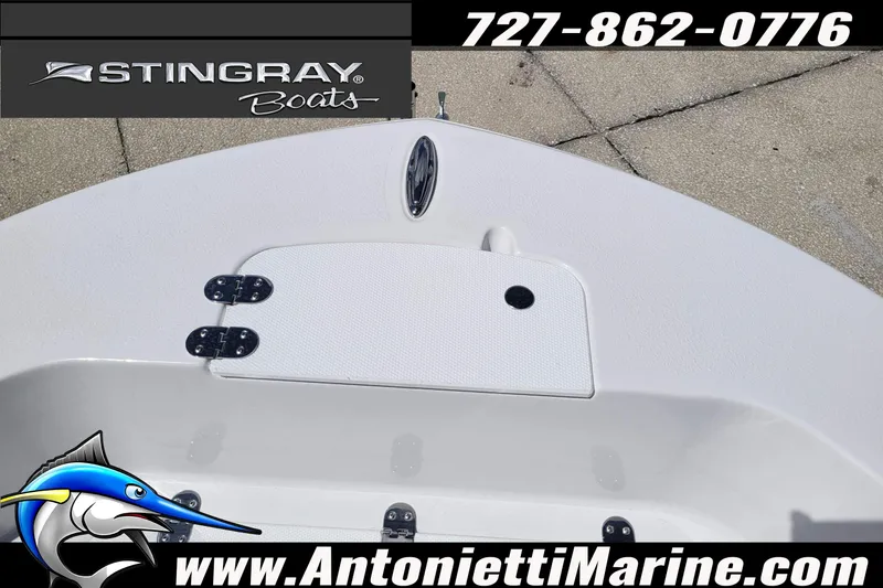 Slide: The Image of 2026 Stingray 173CC boat deck, featuring storage compartment and marine branding. - 11
