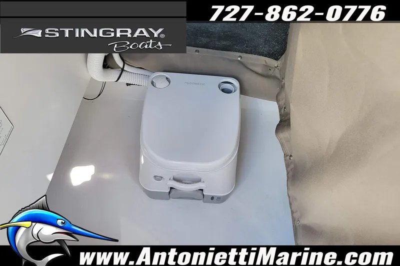 Slide: The Image of Portable toilet inside 2026 Stingray 173CC boat, featuring compact design and marine accessories. - 16