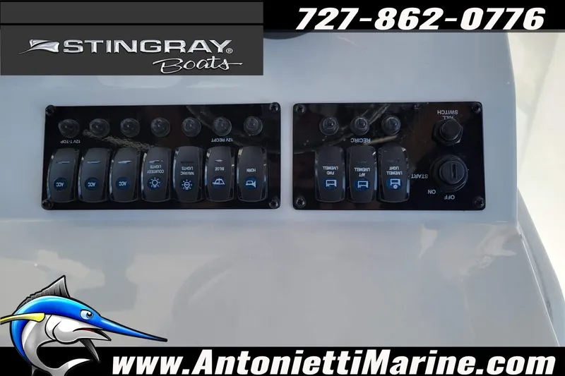 Slide: The Image of Control panel of a 2026 Stingray 173CC boat with switches and logo. - 25
