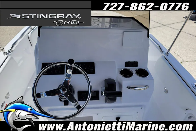 Slide: The Image of 2026 Stingray 173CC boat dashboard with steering wheel and controls, Antonietti Marine branding. - 28