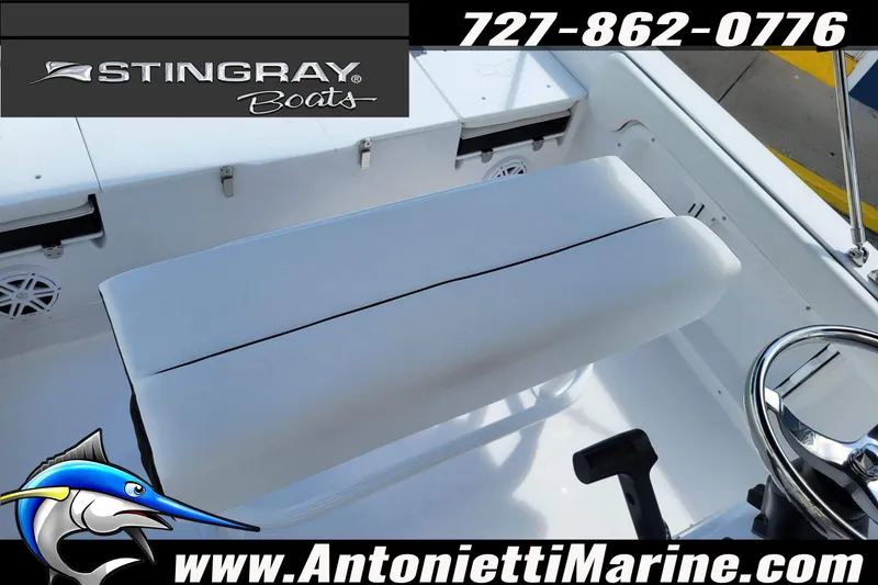 Slide: The Image of 2026 Stingray 173CC boat interior with seating and steering wheel, featuring marine branding. - 29