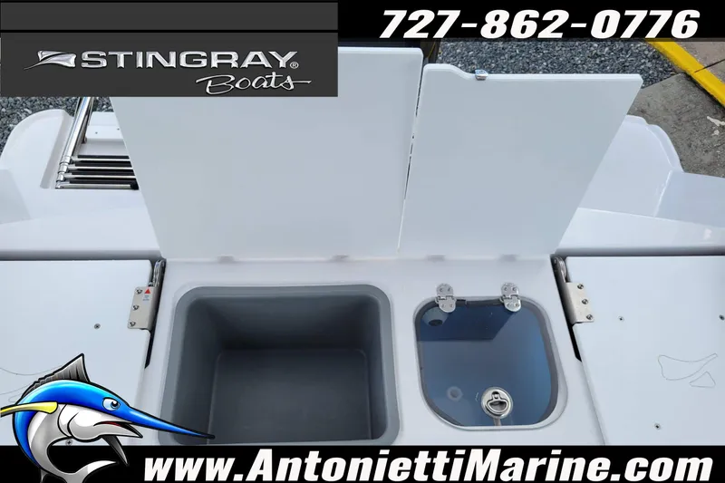 Slide: The Image of 2026 Stingray 173CC boat deck with storage compartments and marine branding. - 40