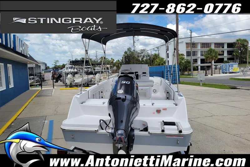 Slide: The Image of 2026 Stingray 173CC boat with outboard motor at Antonietti Marine dealership. - 52