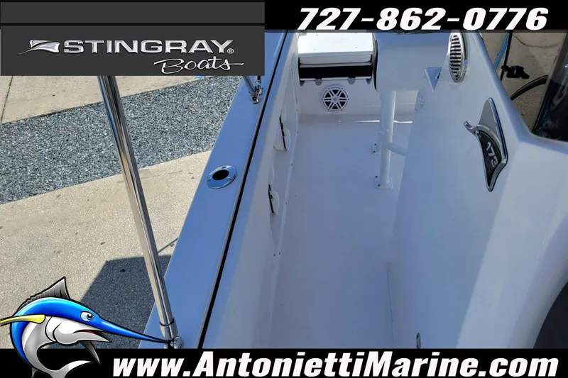 Slide: The Image of 2026 Stingray 173CC boat interior with branding and contact details. - 6