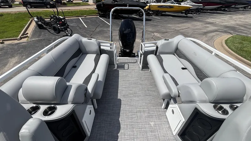 Slide: The Image of 2025 JC Neptoon 25TT Sport pontoon boat interior with gray seating and cup holders. - 10