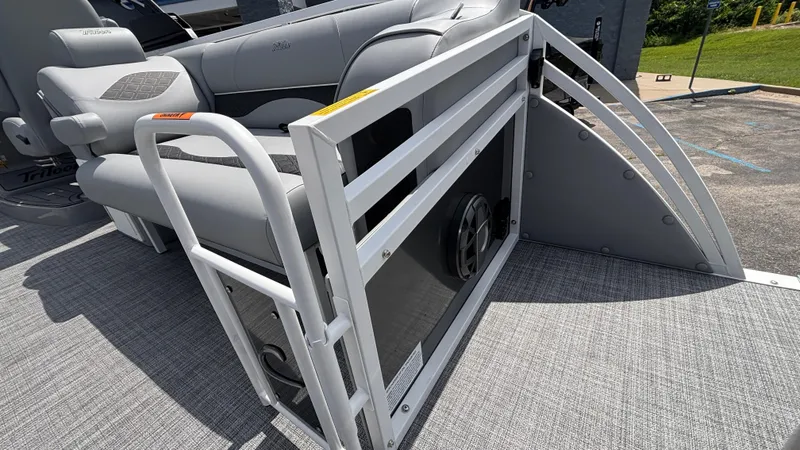 Slide: The Image of 2025 JC Neptoon 25TT Sport pontoon boat with gray seating and safety railing. - 14