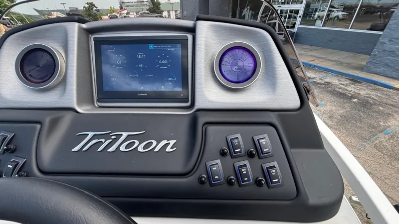 Slide: The Image of Dashboard of 2025 JC Neptoon 25TT Sport with digital display and controls. - 25