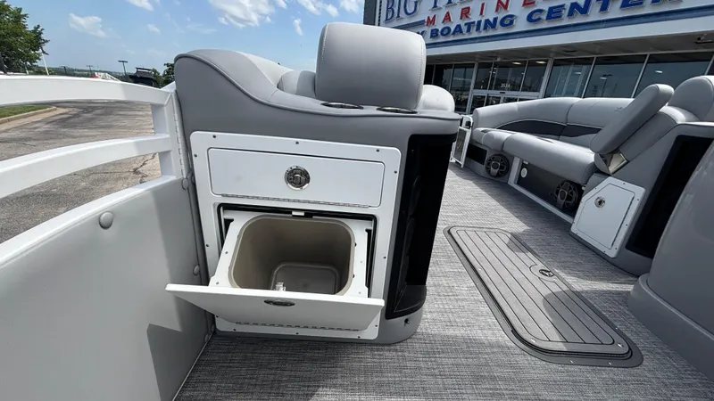 Slide: The Image of 2025 JC Neptoon 25TT Sport boat interior with open storage compartment and seating. - 32