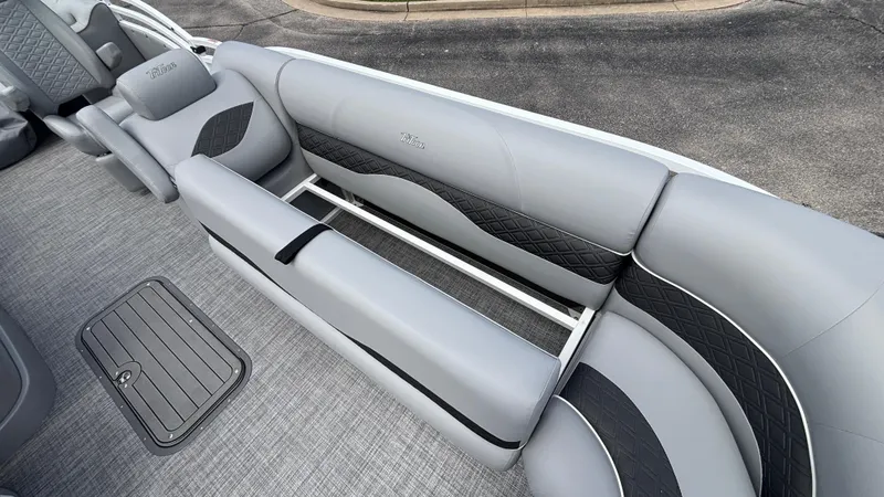 Slide: The Image of 2025 JC Neptoon 25TT Sport boat interior with gray and black seating. - 35