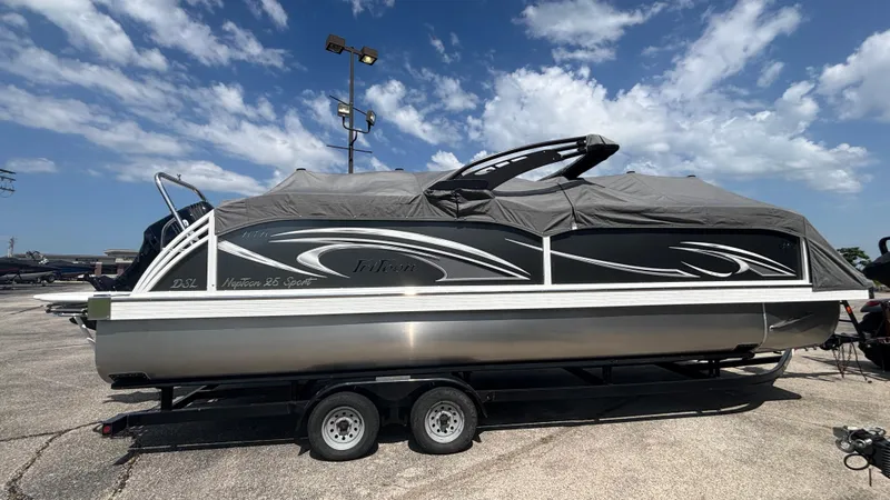 Slide: The Image of 2025 JC Neptoon 25TT Sport pontoon boat on trailer under a cloudy sky. - 9