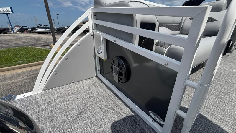 Slide: The Image of 2025 JC Neptoon 25TT Sport boat interior with speaker and seating, showcasing modern design. - 13